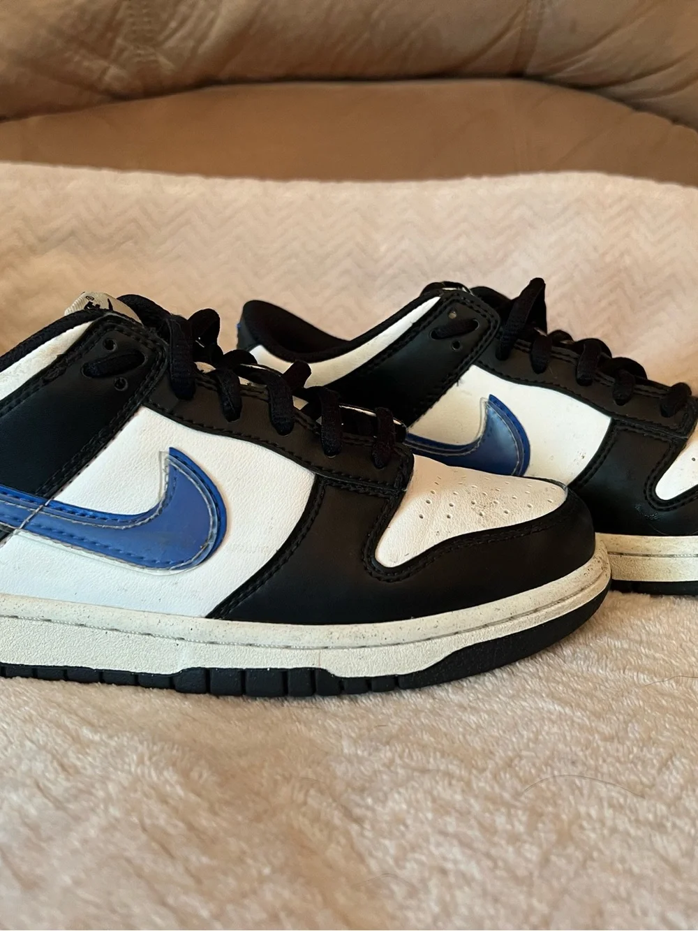 Nike Kids Dunk Low in Black, White & Blue Swoosh